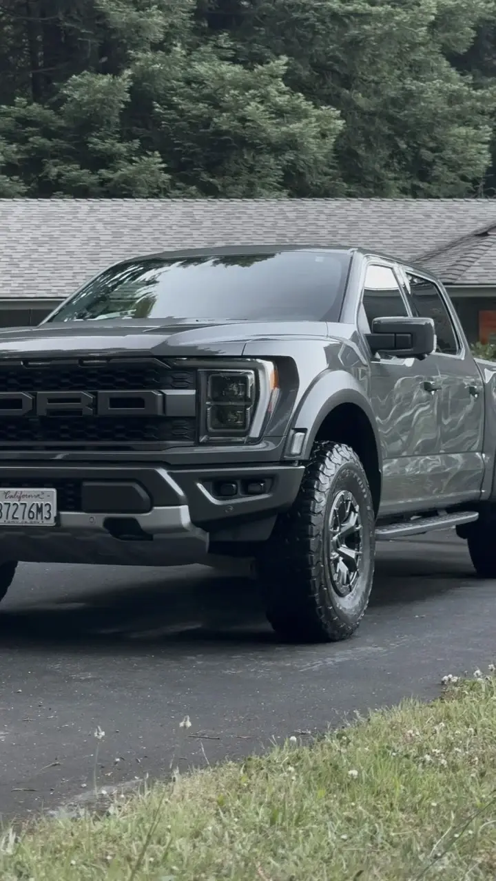 Front view of a grey Ford truck with a clean, rugged appearance.